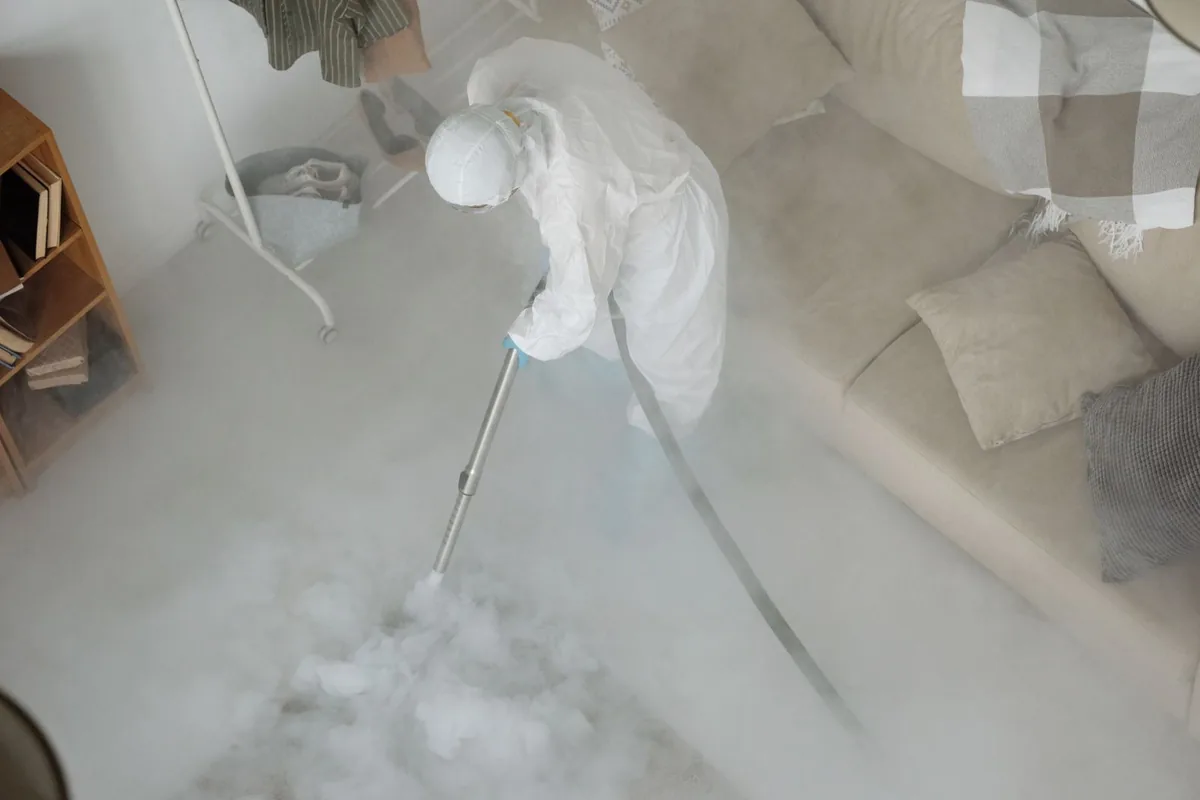 Biohazard cleanup technician in protective equipment, Crystal City, MO